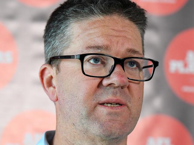 The AFL Players' Association (AFLPA) CEO Paul Marsh addresses the media on the AFLPA Boards position regarding COVID-19 during a press conference at AFLPA Office in Melbourne, Tuesday, March 17, 2020. Marsh has announced that both AFL and AFLW playing groups are prepared to play as soon as they are given the green light by the AFL. (AAP Image/James Ross) NO ARCHIVING