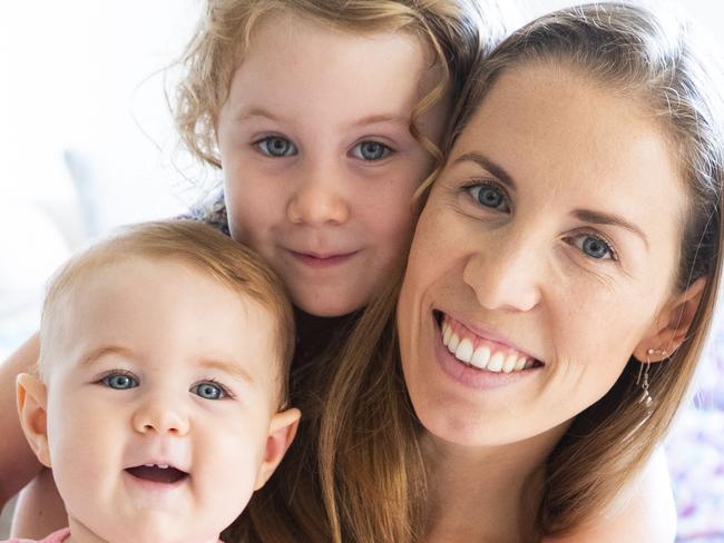 Sunrise Beach Mum Pam Fernandes with daughters Sophie 3, and Mallie 10 months. Photo Lachie Millard