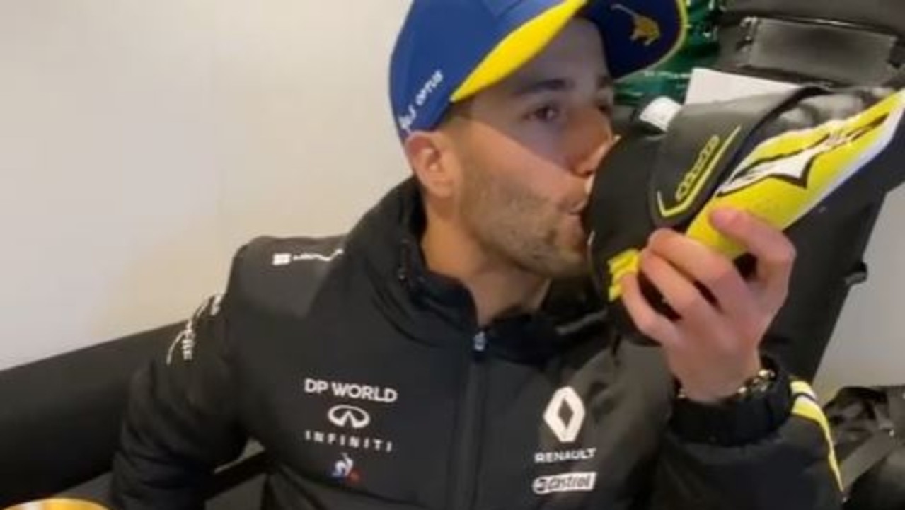 Daniel Ricciardo does a ‘shoey’ after his podium finish in Germany.