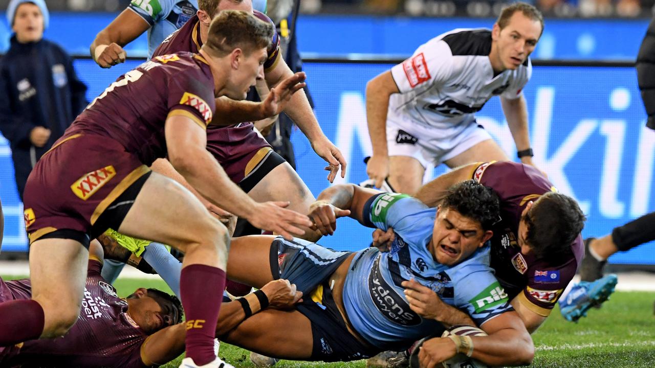 Latrell Mitchell reaches for the tryline against the Maroons in his first Origin encounter.