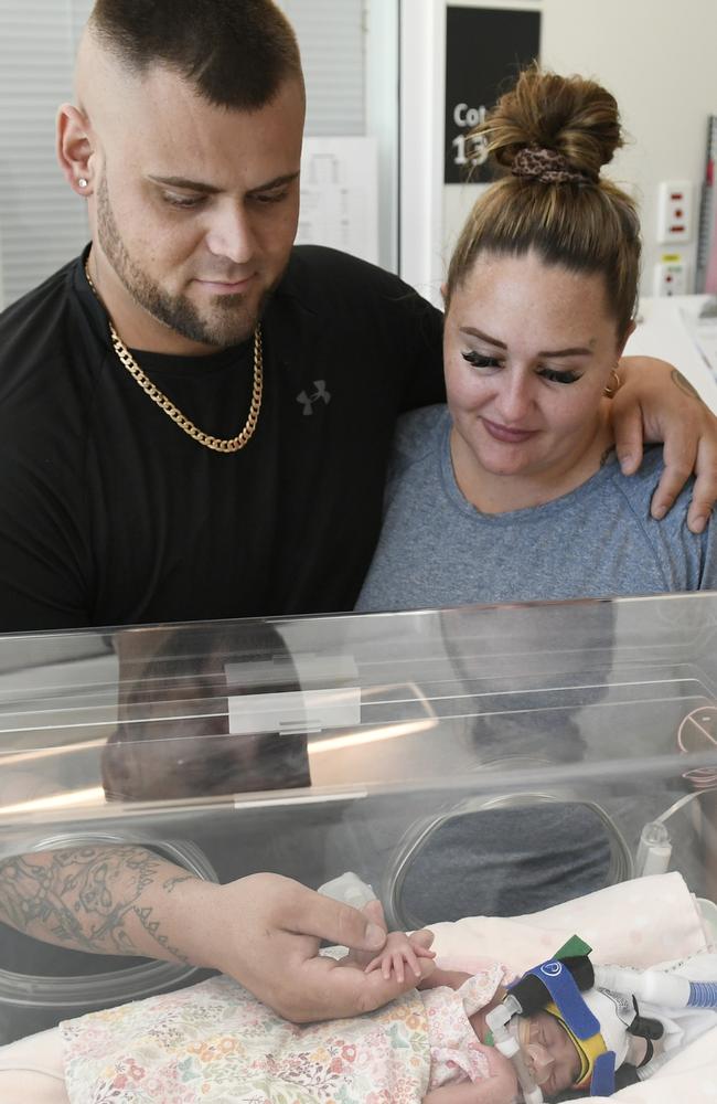 Parents Zachary and Emma watch over their 'perfect' child.