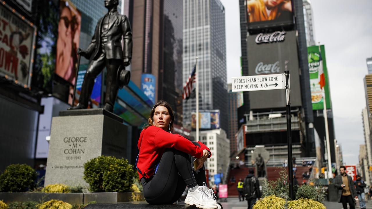 Blandine Audusseau, 26, pauses to sit in a sparsely populated Times Square due to COVID-19 concerns, Friday, March 20, 2020, in New York. "We are scared for everybody," said Audusseau, a native of Corsica, France, who moved to Manhattan four months ago. Picture: AP /John Minchillo.