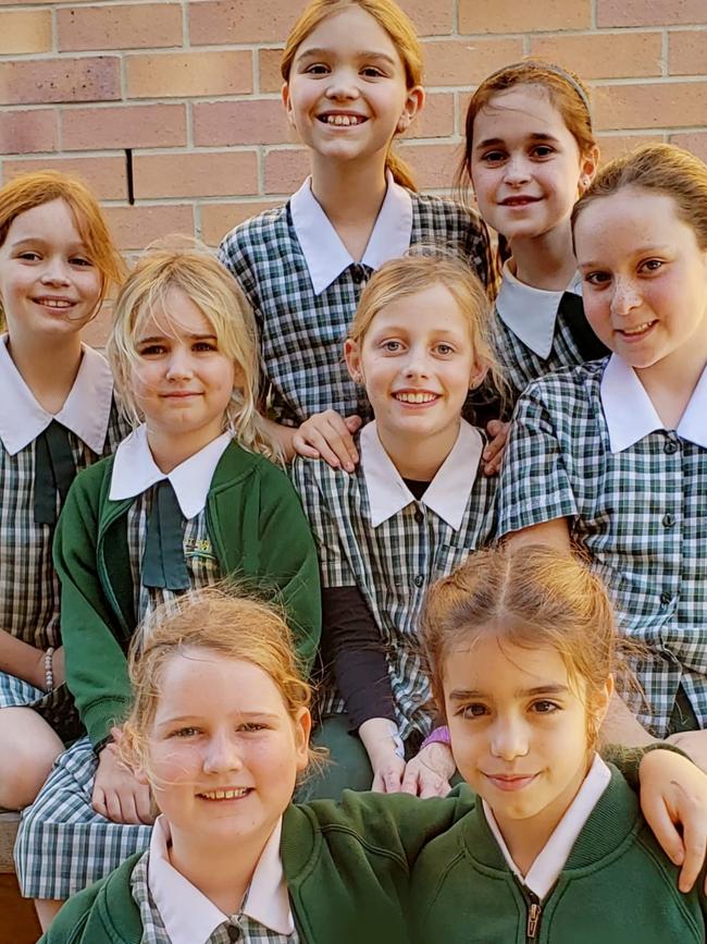 Johanna (centre) and her school friends will walk the Bridge to Brisbane to raise awareness and money for EB research. Photo supplied.