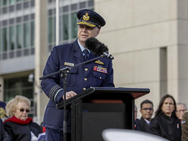 **RE-TRANSMISSION CAPTION CORRECTION** Correcting Name**  Air Chief Marshal Mark Binskin addresses the crowd while Chief of the Defence Force, General Angus Campbell looks on (right), at Blamey Square, in Canberra, on Friday, July 6, 2018. Air Chief Marshal Binskin formally handed over the role of Chief of the Defence Force to General Angus Campbell at the ceremony. (AAP Image/Sean Davey) NO ARCHIVING