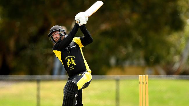 Simon Cormie hits long on his way to 88 for Mentone against Hampton on Saturday. Picture: Josh Chadwick