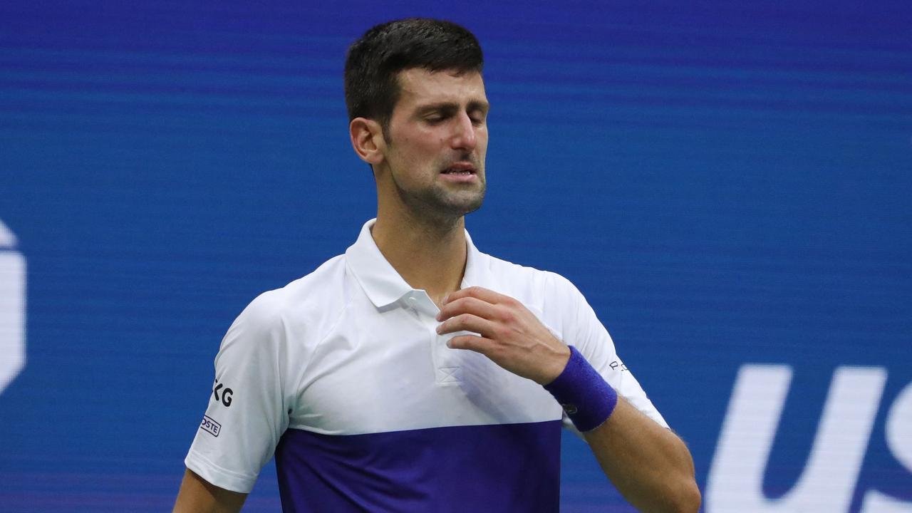 (FILES) In this file photograph taken on September 13, 2021, Serbia's Novak Djokovic reacts after defeat against Russia's Daniil Medvedev after their 2021 US Open Tennis tournament men's final match at the USTA Billie Jean King National Tennis Center in New York. - Novak Djokovic announced on August 25, 2022, shortly before the draw, that he would not be able to take part in the US Open, which starts on August 29, because he cannot travel to the United States because he has not been vaccinated against Covid-19. (Photo by Kena Betancur / AFP)