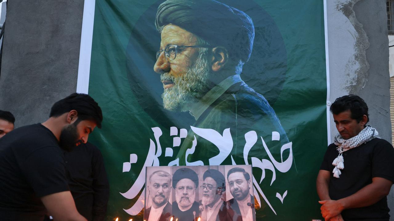 Iraqis light candles for Ebrahim Raisi in Baghdad. Picture: Ahmad al-Rubaye/AFP