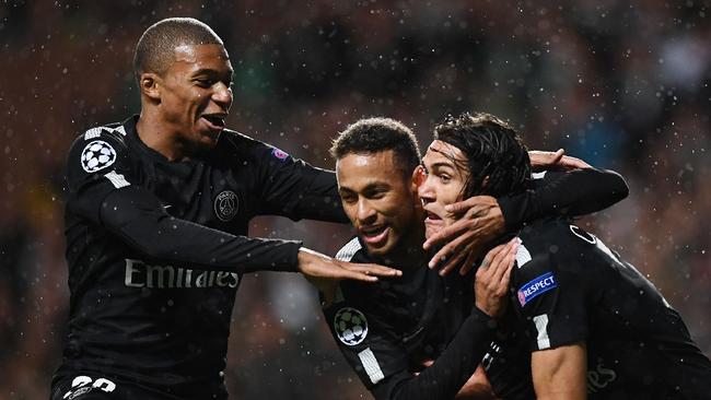Neymar (C) celebrates with Paris Saint-Germain's French striker Kylian Mbappe (L) and Edinson Cavani.