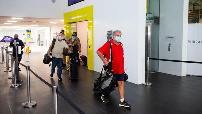 Passengers from two flights from Adelaide arriving at Darwin International Airport this morning, QF860 and JQ692, have been quarantined after the NT once again closed its borders to SA. Passengers were in the air when the decision was made, and were given the option to return to Adelaide or quarantine for two weeks in Howard Springs. Picture: Che Chorley