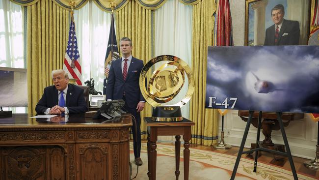 President Donald Trump, left, and Secretary of Defense Pete Hegseth listen as an image of an F-47 sixth-generation fighter jet is displayed during an event in the Oval Office. Picture: AP