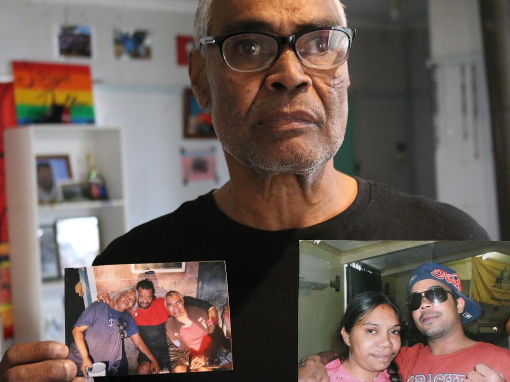 Keith Dutton holds up photos of Lasonya and her brother Keith Jnr, along with other family members. Picture: Dijana Damjanovic