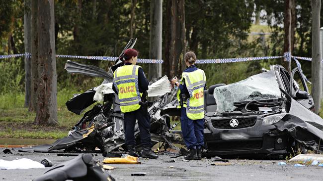 Police at the scene of the fatal crash. Picture: Adam Yip