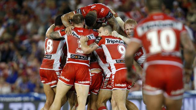 Dragons players celebrate winning golden point during the Round 4 NRL match between the Newcastle Knights and St George Illawarra Dragons at McDonald Jones Stadium in Newcastle, Sunday, April 7, 2019. (AAP Image/Darren Pateman) NO ARCHIVING, EDITORIAL USE ONLY