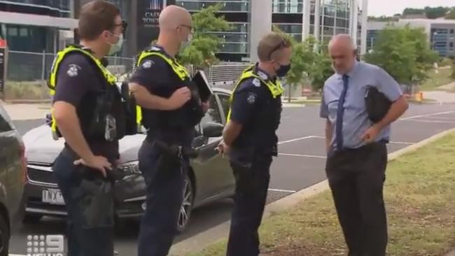 The Revival Church pastor Paul Furlong speaks to police after a service in Narre Warren that breached lockdown restrictions on Sunday. Picture: Twitter/@9NewsMelb