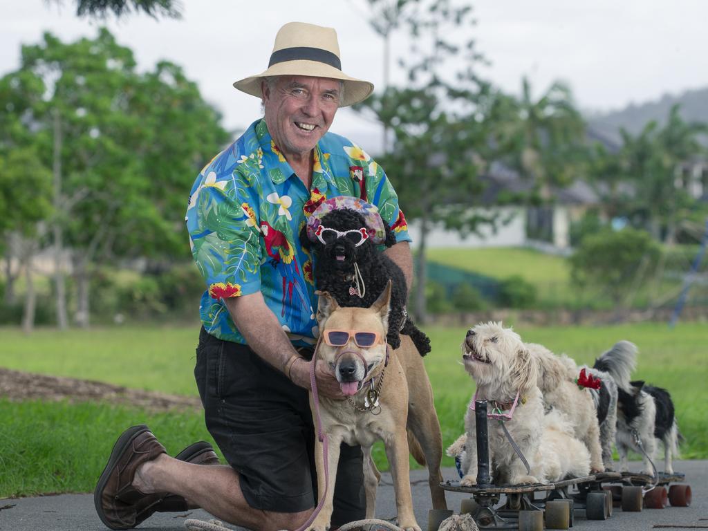 Brian Reichelt and his skateboarding dogs: Zoe, Lulu, Sootie, Omo, Caramello and Oreo are bringing joy to Gold Coasters. Picture: Glenn Campbell