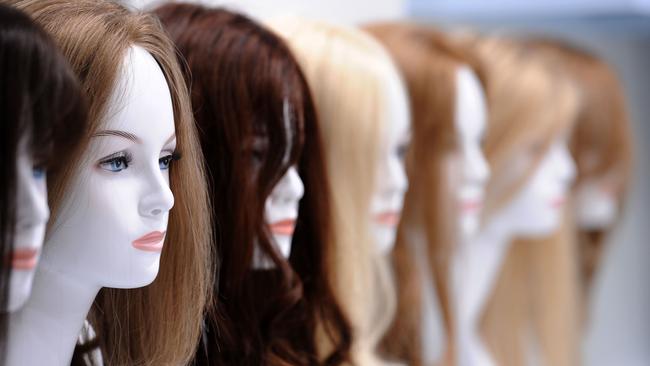 Mannequins wearing wigs for women made of real hair.