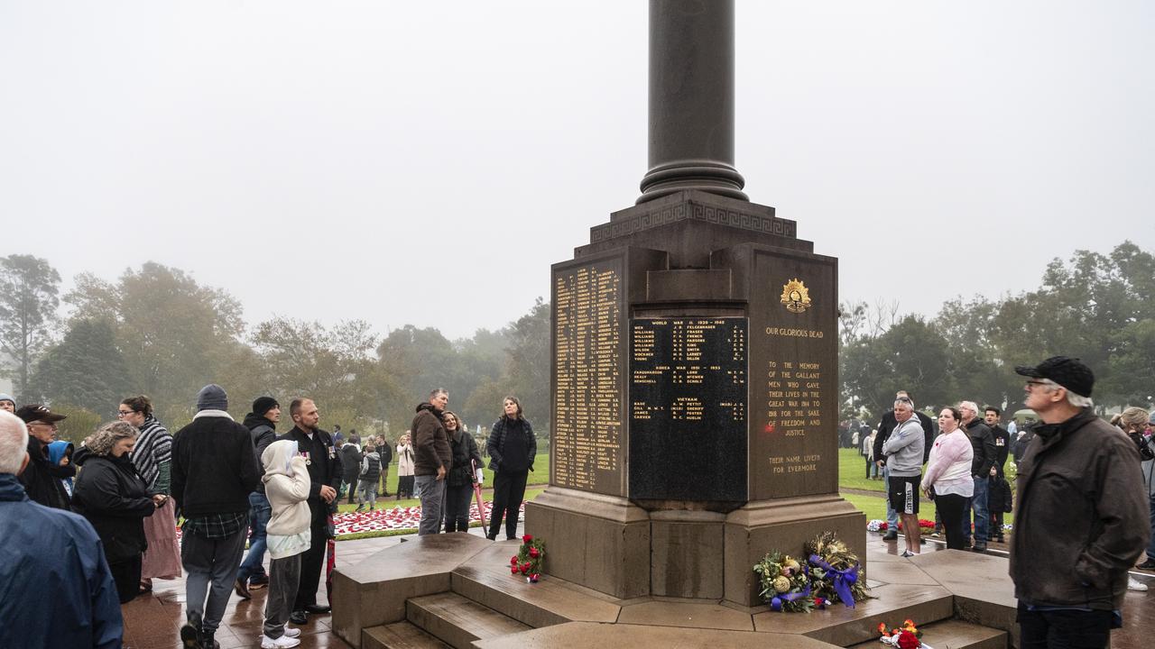 Anzac Day dawn service attendees pay their respects after the service at the Mothers' Memorial, Monday, April 25, 2022. Picture: Kevin Farmer