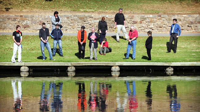 Gay activists in 2005 on the banks of the Torrens River, reflect on the death of Dr George Duncan 33 years after his death. Picture: Lindsay Moller/News Corp