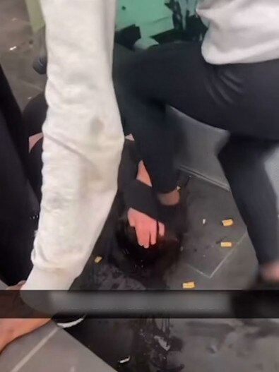 One video shows the woman stomping on a victim.