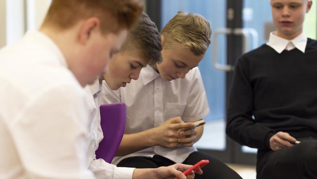 Parents say mobile phones in schools are preventing students from socialising with each other. Picture: iStock
