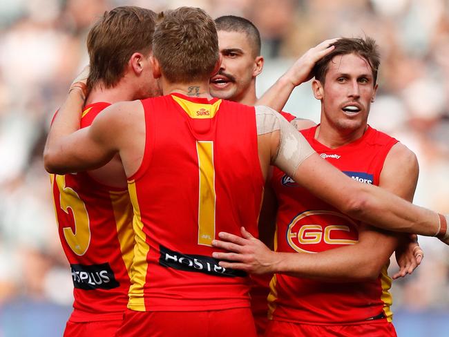 MELBOURNE, AUSTRALIA - MAY 01: Hugh Greenwood (left) and David Swallow of the Suns celebrate during the 2021 AFL Round 07 match between the Collingwood Magpies and the Gold Coast Suns at the Melbourne Cricket Ground on May 01, 2021 in Melbourne, Australia. (Photo by Michael Willson/AFL Photos via Getty Images)