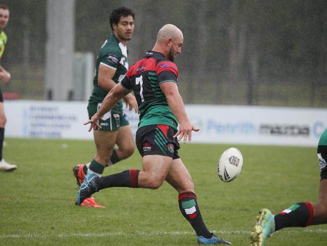 BJ Hudd gets a kick away. Picture Warren Gannon Photography