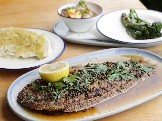 The Signature Sole Meuniere dish with grilled broccolini, sugarloaf wedge salad and crispy kifler potato sides at Sole restaurant at Marcoola on the Sunshine Coast.