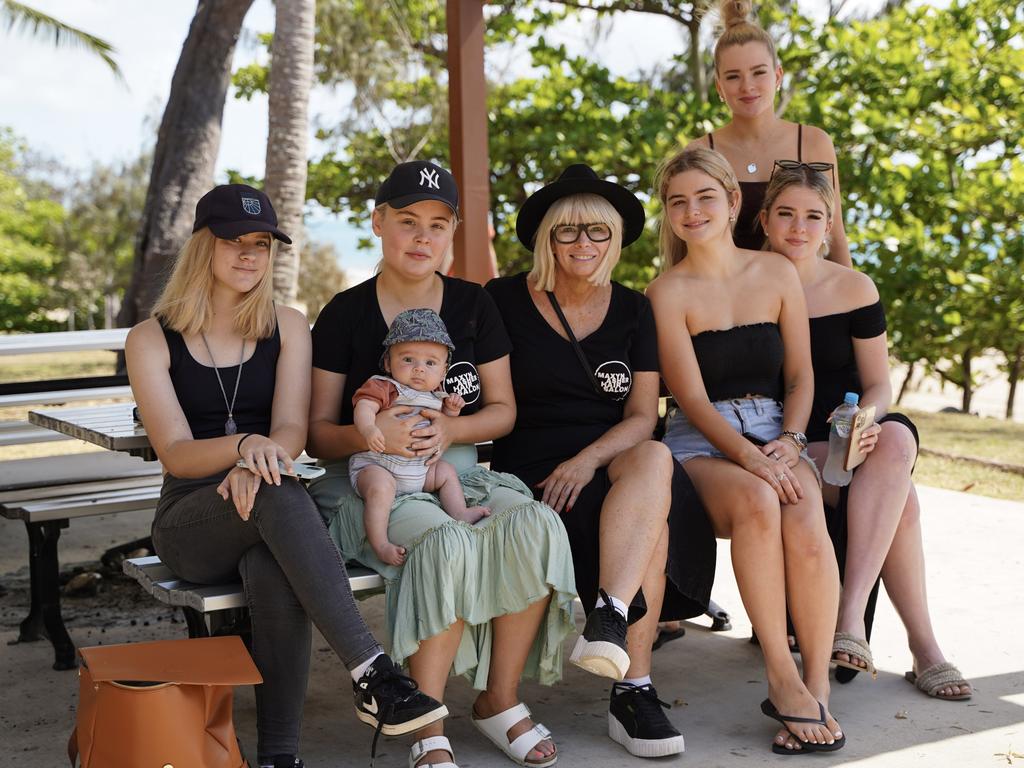 The extended Maxyn Asher Hair Salon family (from left): Amelia McDonnell, co-owner Hannah Graham with son Wyatt, 3 months, co-owner Nicole McDonnell, Paige Smith and sisters Amy Smith and Ella Smith, show their support at the Reclaim the Beach event for co-worker Kaitlin Jones who was allegedly stabbed multiple times at Blacks Beach on September 13. Picture: Heidi Petith