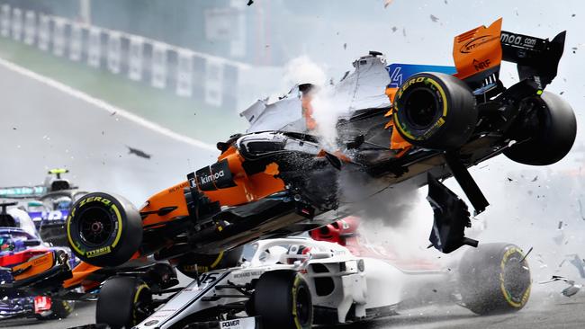 Fernando Alonso of Spain crashes with Charles Leclerc of Monaco at the start of the Formula One Grand Prix of Belgium. Picture: Getty Images.