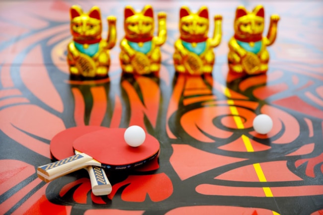 Try your hand at ping pong or get a photo with 888 lucky waving cats at Melbourne Central this Chinese New Year. Photo: Supplied