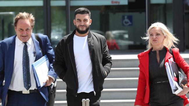 Mr Portelli with his lawyers at an earlier hearing in December 2024. Picture: NewsWire/ David Crosling