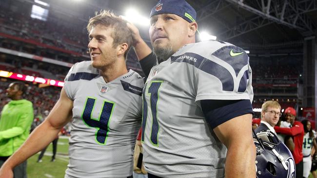 Seattle kicker Sebastian Janikowski #11 celebrates with holder Michael Dickson after booting the game-winning field goal against Arizona today. Picture: Getty Images/AFP