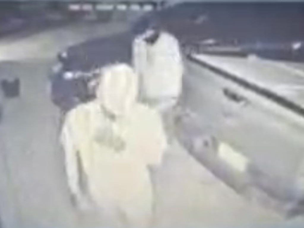 The masked males captured on CCTV