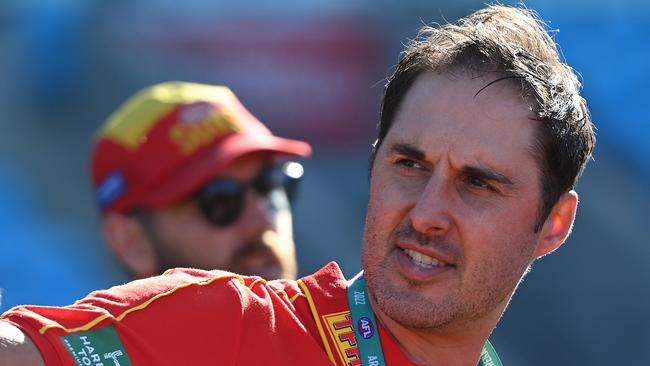 HOBART, AUSTRALIA - AUGUST 27: Cameron Joyce Head coach of the Suns talks to the players during the round one AFLW match between the North Melbourne Kangaroos and the Gold Coast Suns at Blundstone Arena on August 27, 2022 in Hobart, Australia. (Photo by Steve Bell/Getty Images)