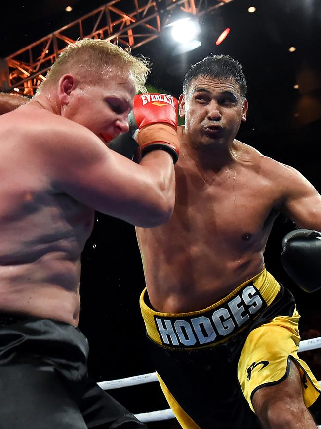 Justin Hodges punches Ben Hannant. Picture: Albert Perez/Getty