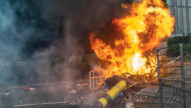 Protesters burn the barricades during a rally in Shatin area. Picture; Getty Images.