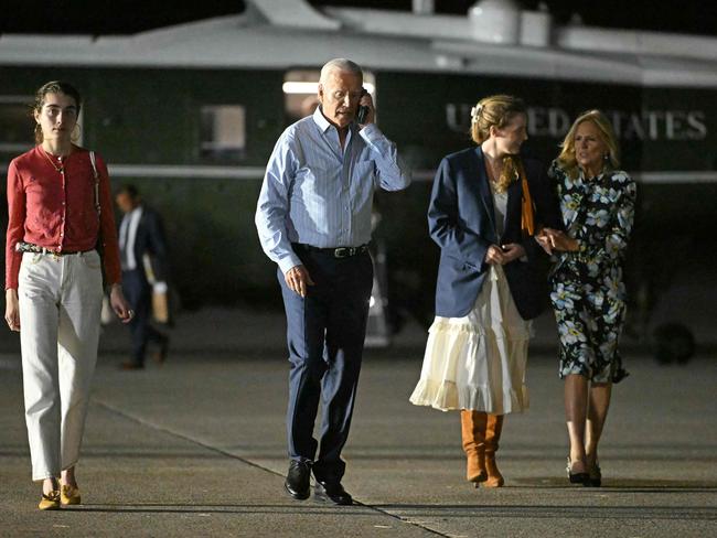 US President Joe Biden and First Lady Jill Biden, with granddaughters Natalie (left) and Finnegan (second right), make their way to board Air Force One on their way to Camp David. Picture: Mandel Ngan / AFP