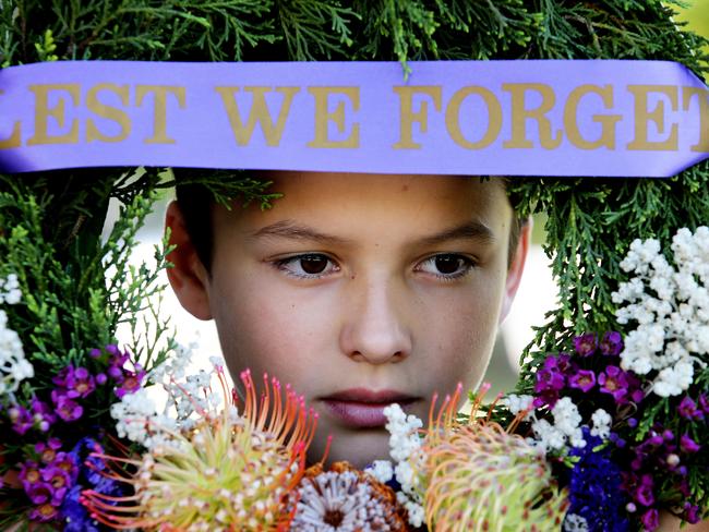 Newcastle East Public School captain Noah Handley remembers the fallen at at Civic Park War Memorial in Newcastle. Picture by Peter Lorimer