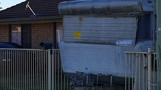 Neighbours saw a man injecting drugs into his arm inside this caravan.