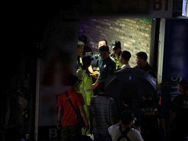 Rescue workers inside the nightclub. Picture: AFP