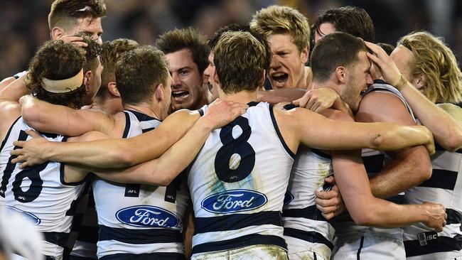 Geelong players celebrate after the game. Picture: AAP