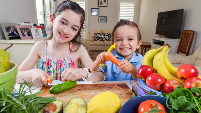 Alannah, 8, and brother Josh, 3, getting healthy in the kitchen. Picture: Picture: Brenton Edwards