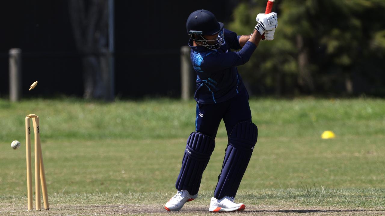 There go the stumps of Parag Vadhwani from Clayton Districts as he is bowled by Angus Macquire. Picture: Hamish Blair