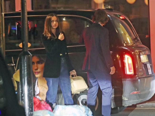 The rumoured new couple left the restaurant together in a taxi with two bags of food in hand. Picture: BACKGRID