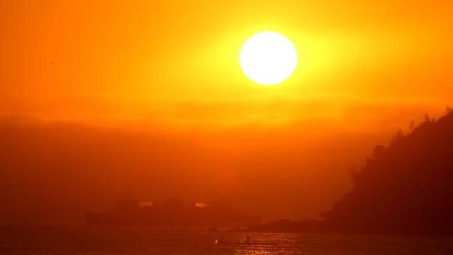No relief: Sunrise from Balmoral this morning. The heat won’t ease much tonight. Picture: John Grainger