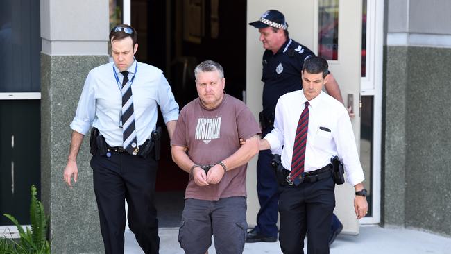 Rick Thorburn being escorted by police from the Logan Central Police Station, Queensland in 2016 (AAP Image/Dave Hunt)