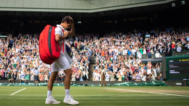 Roger Federer leaves the court after losing to Poland's Hubert Hurkacz.