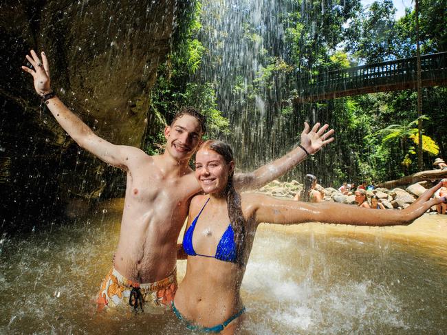 Elise Smith 17, and Josh Neville 18, from Brisbane beat the heat with a dip at Buderim Falls on the Sunshine Coast. Picture Lachie Millard