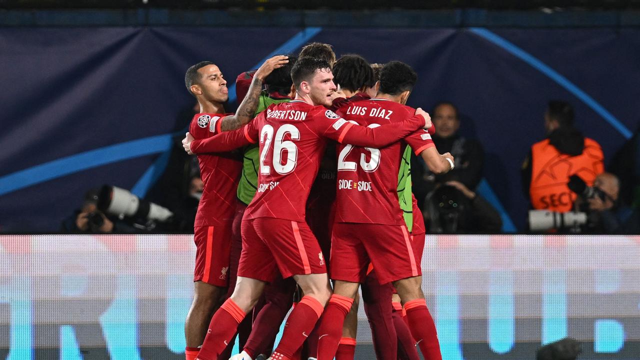 Liverpool's players celebrate after Brazilian midfielder Fabinho scored a goal during the UEFA Champions League semi final second leg football match between Liverpool and Villarreal CF at La Ceramica stadium in Vila-real on May 3, 2022. (Photo by Paul ELLIS / AFP)