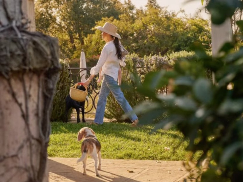 The devoted pooch can also be seen following after Meghan as she strolls around the grounds of their nine-bedroom dwelling. Picture: Instagram/Meghan